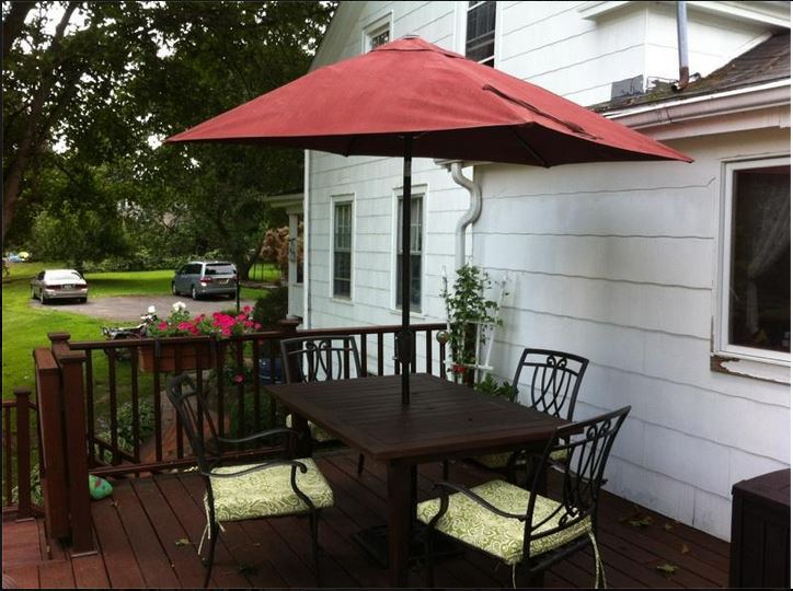 The Purple Painted Lady Patio Umbrella Primer Red after